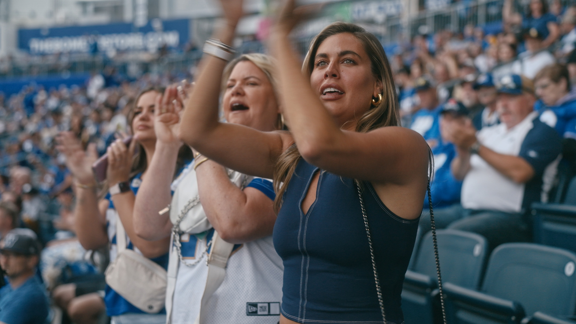 Must Love Dog's Alex Blumberg applauds the Winnipeg Blue Bombers at their home opener game.